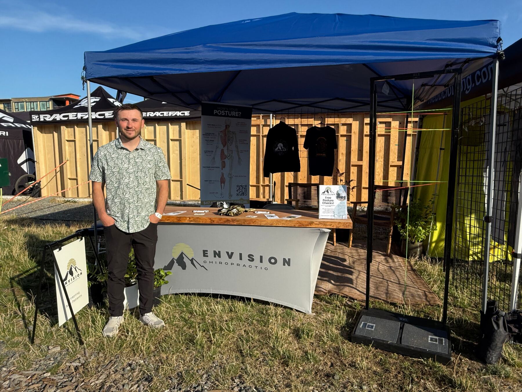 Dr. Dakota at an Envision Chiropractic community event booth in Bellingham