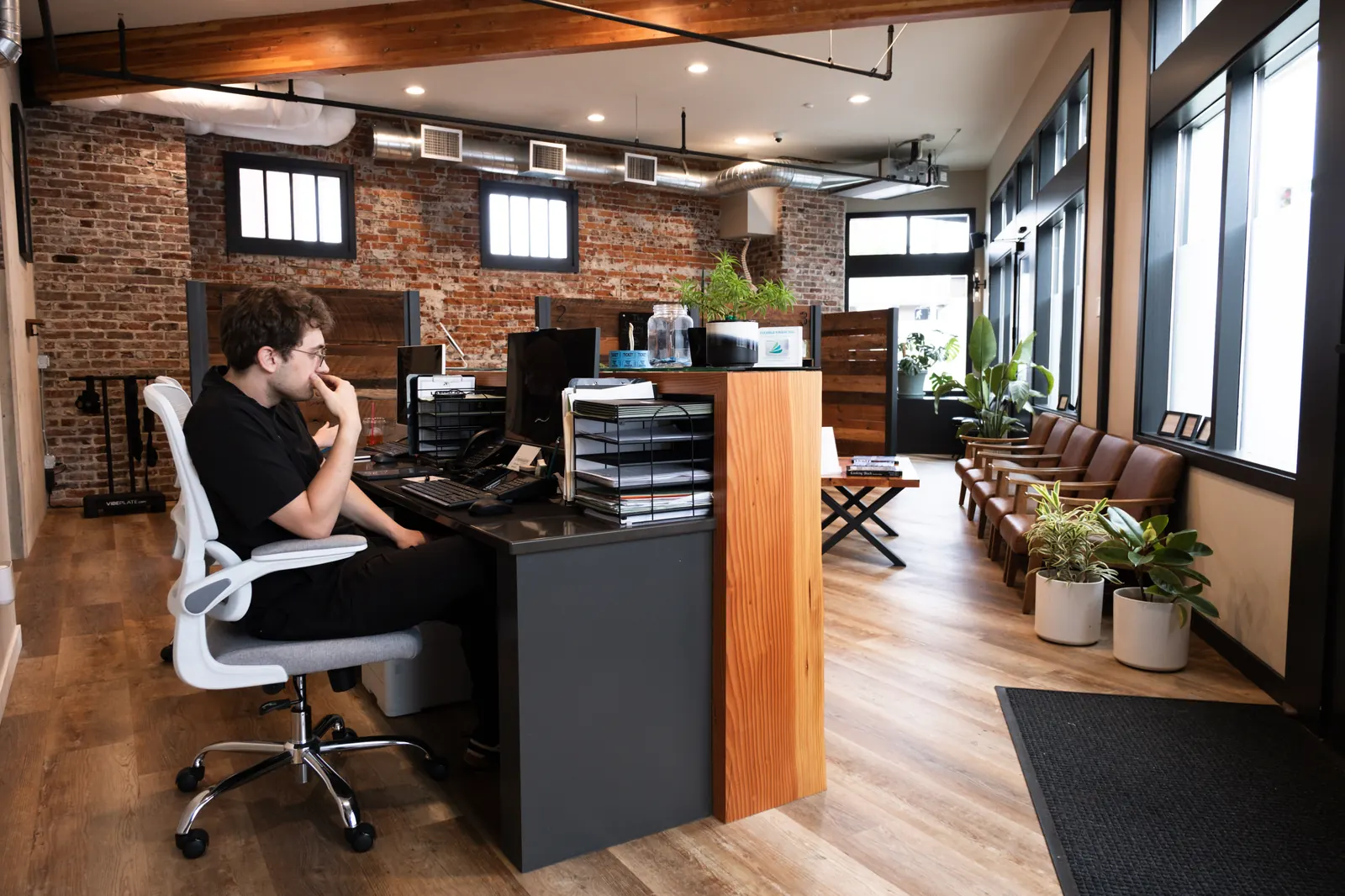 Envision Chiropractic interior — treatment floor, front desk, and waiting area in downtown Bellingham, WA